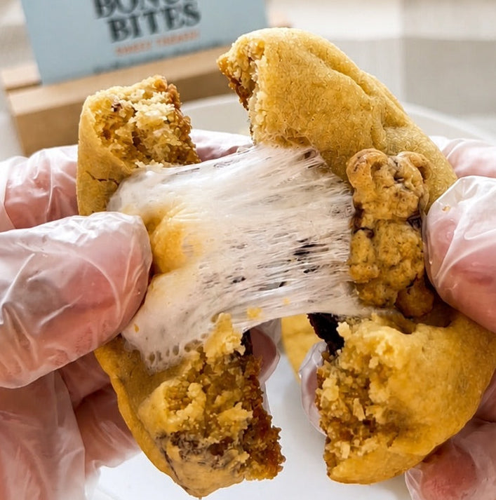 Fresh baked stuffed s’mores cookie with gooey marshmallow center and chocolate chip cookie dough by Bonus Bites